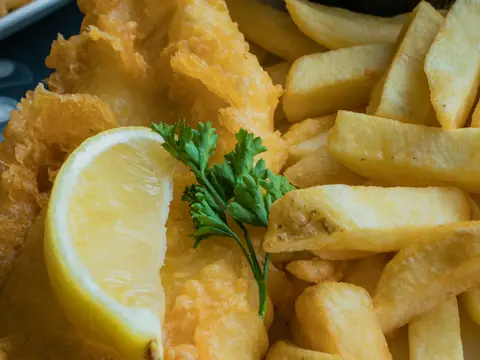Battered fish and chips with lemon