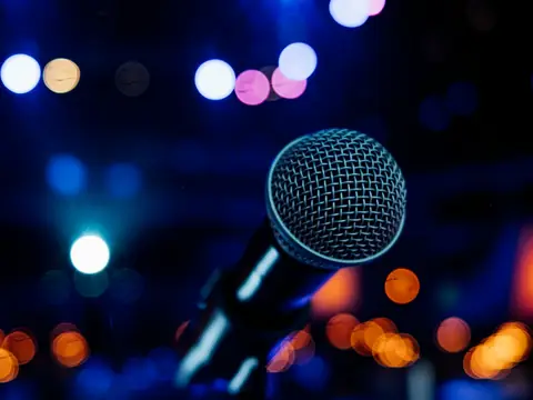 Microphone on a stand under stage lights